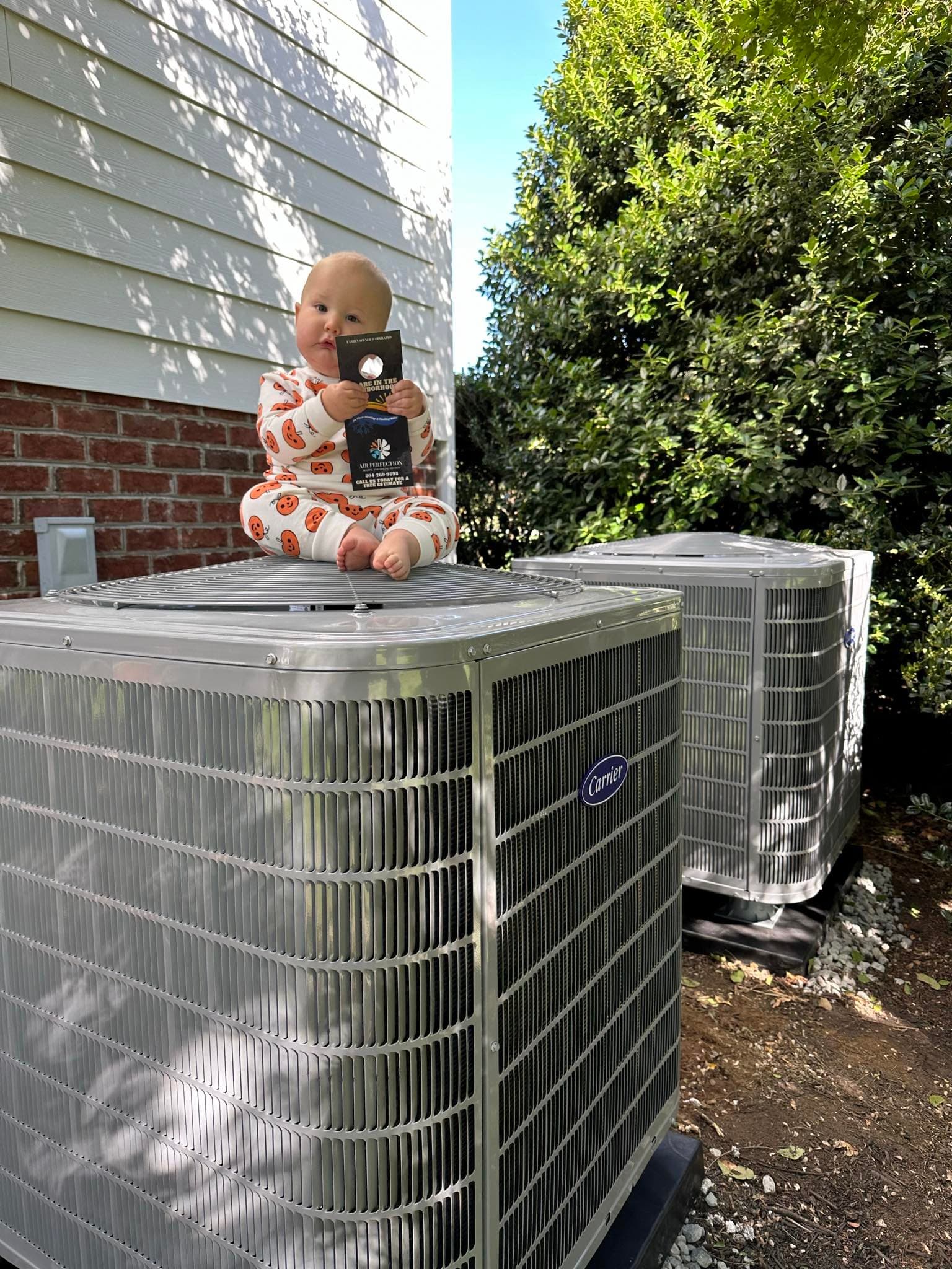 A baby sleeping peacefully, representing comfort and peace of mind provided by Air Perfection's maintenance plans.